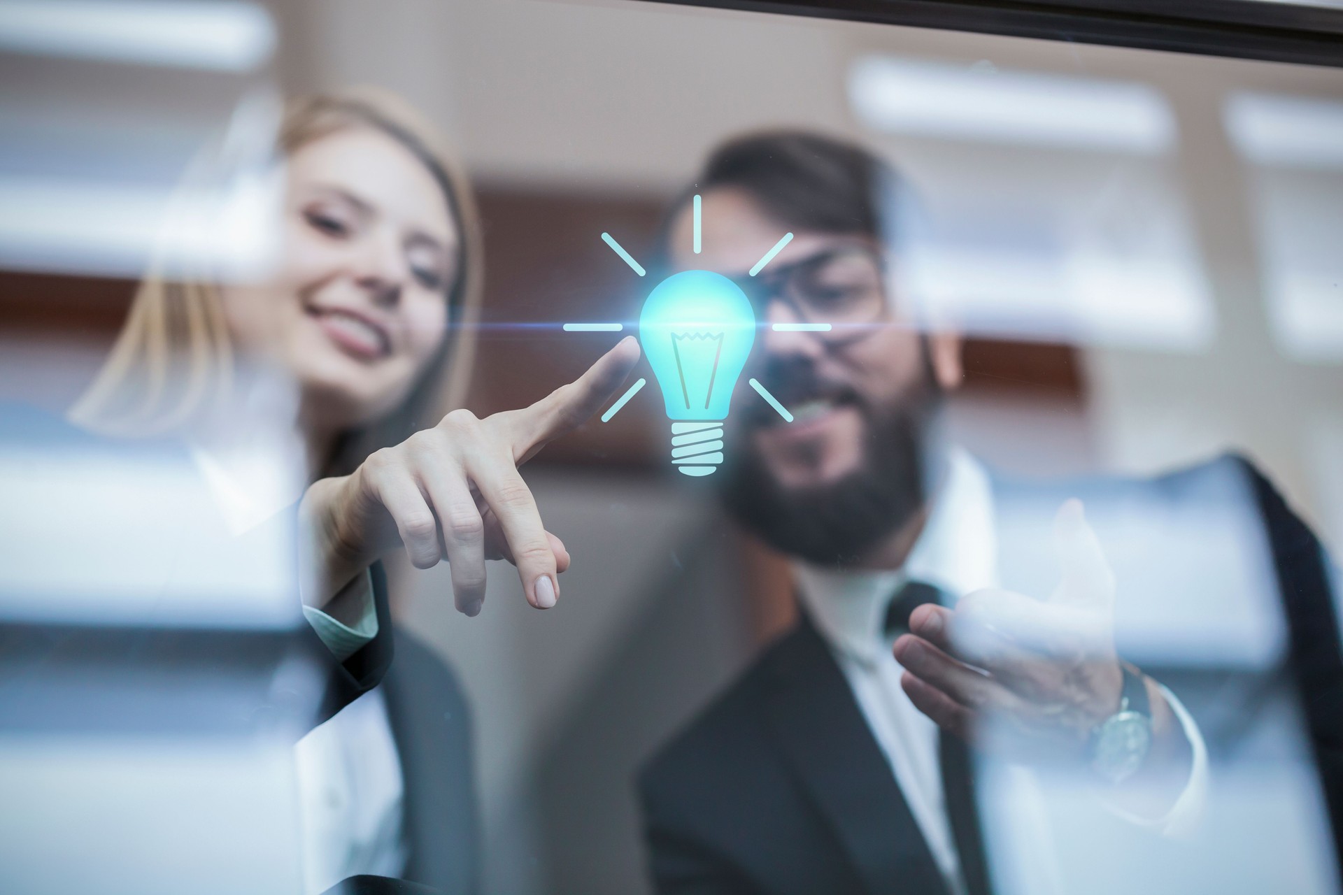 Businesswoman touching a light bulb